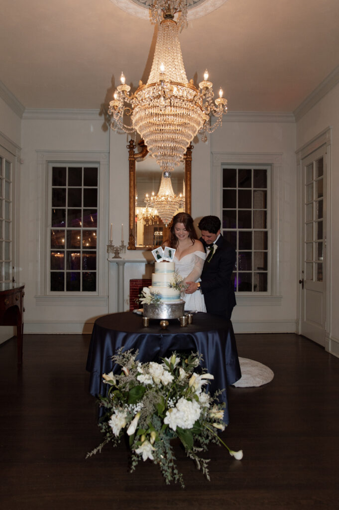 bride and groom cutting cake taken by Austin Wedding Photographer