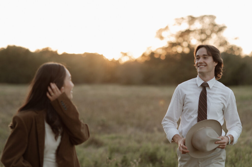 Cinematic engagement photos in a big field in Dallas, TX