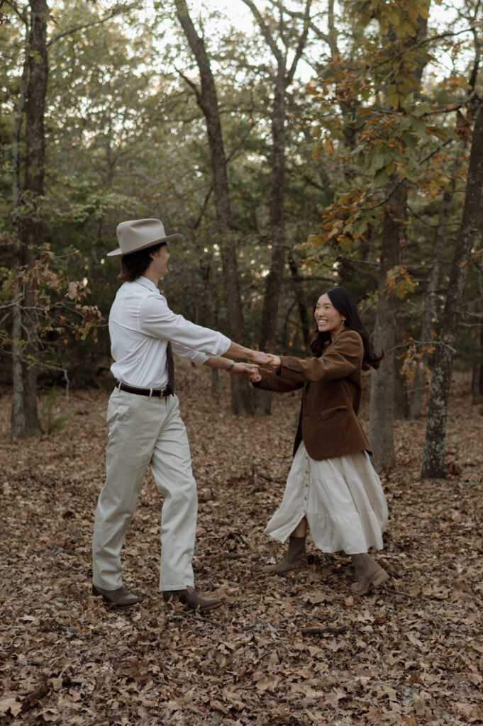 couple dancing in a forest together