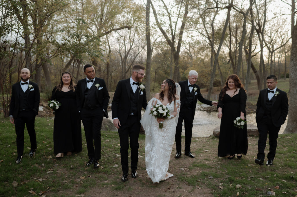 full wedding party photo walking