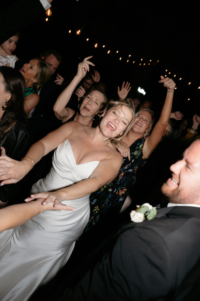 photo of bride dancing at her reception taken by Dallas wedding photographer