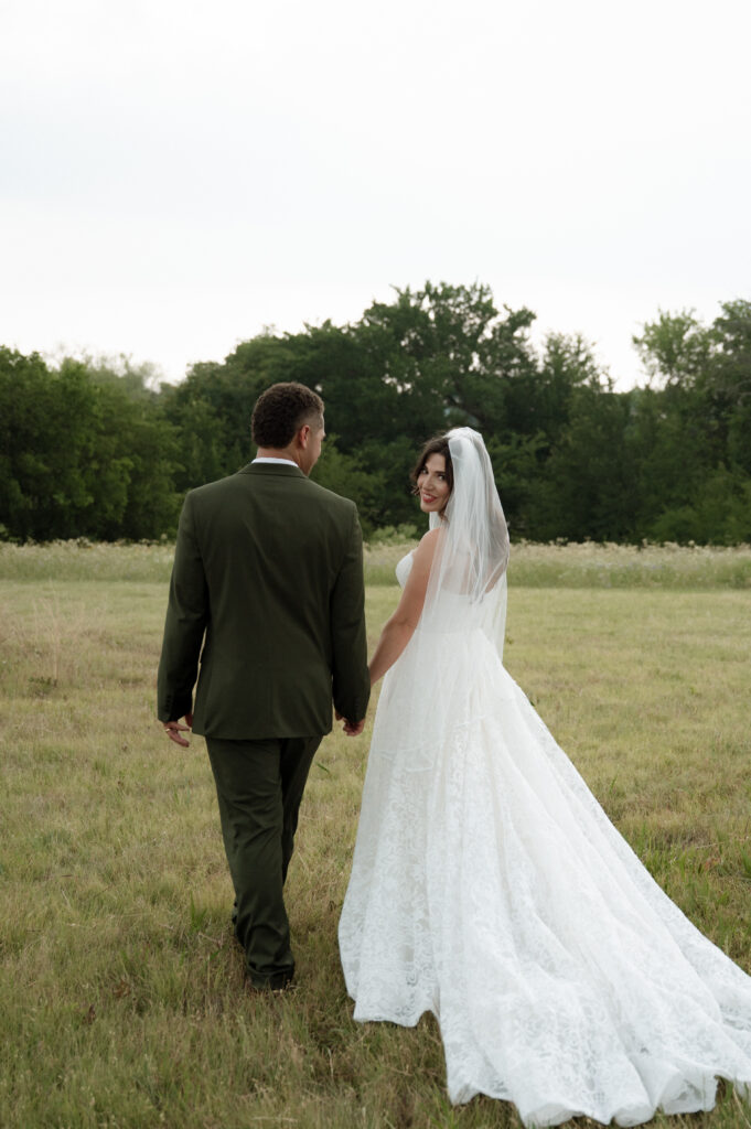 bride and groom walking at Hawthorn Hills Ranch
