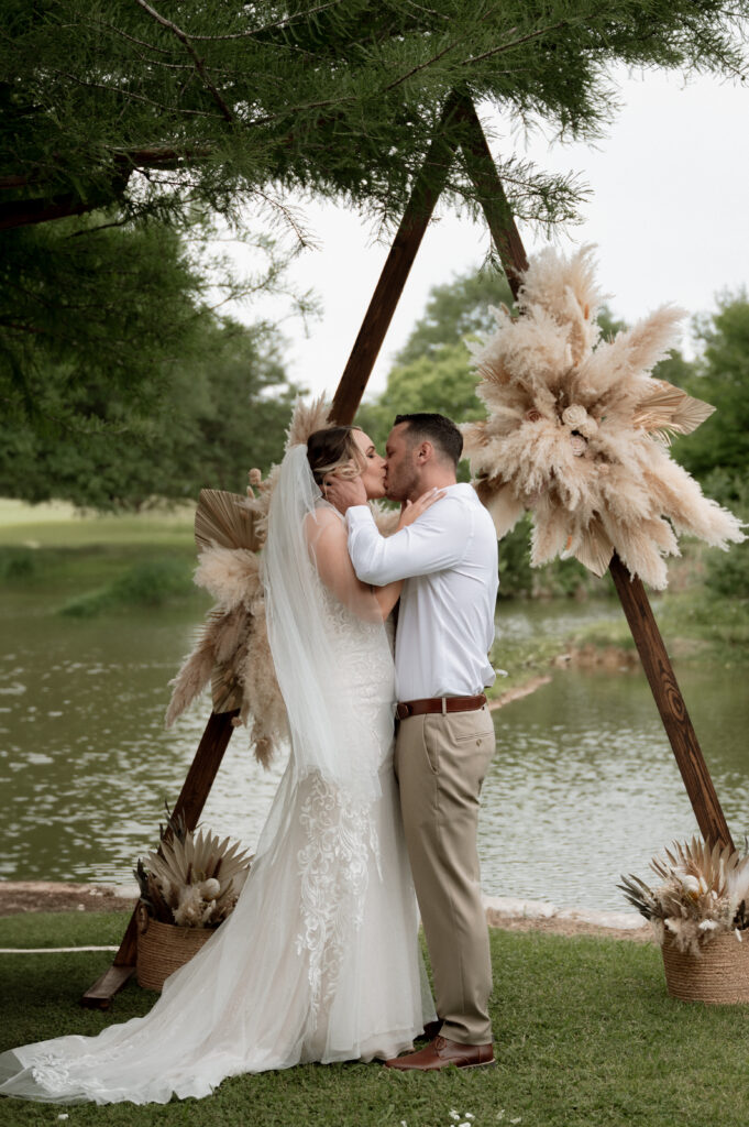 bride and groom first kiss photo