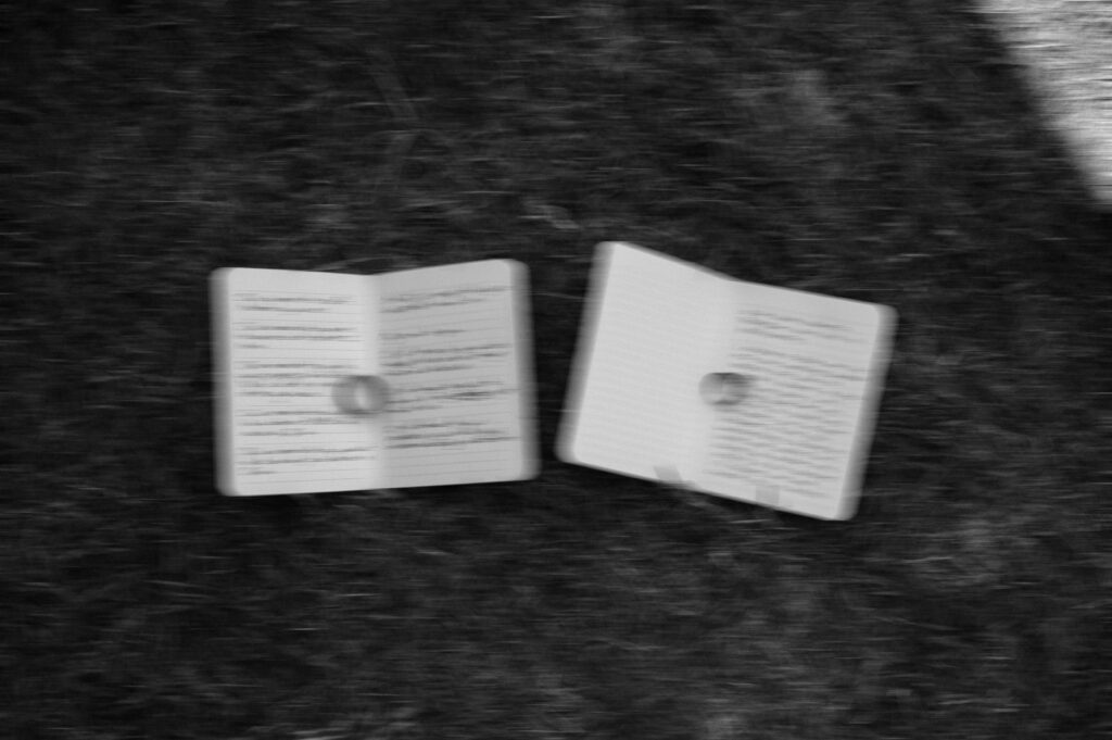 photo of vow books and rings