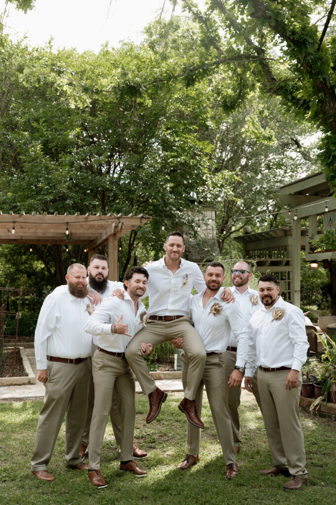 photo of groom and groomsmen having fun