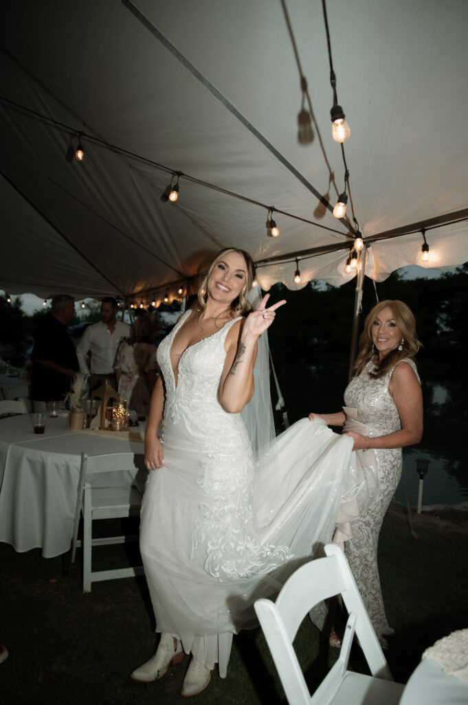 bride and her mom during the wedding reception taken by Fort Worth Wedding Photographer