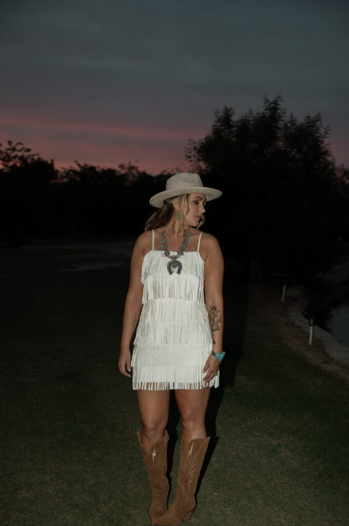Photo of bride in her reception dress and shoes taken by Nicole Endress Photography