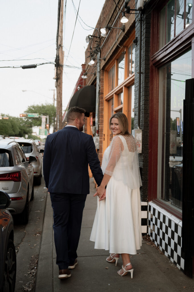 couple walking on a sidewalk