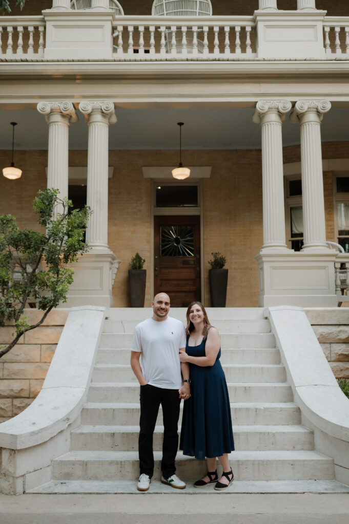 engaged couple smiling for engagement photos at Hotel Ella