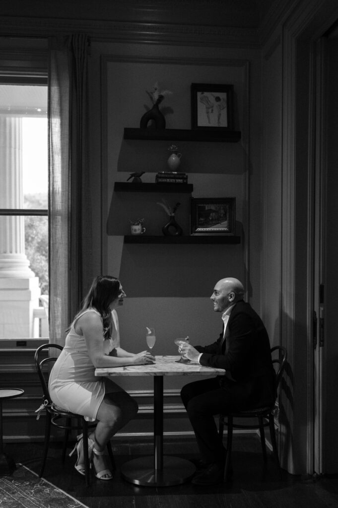 Engaged couple having a drink inside Hotel Ella in Austin, TX