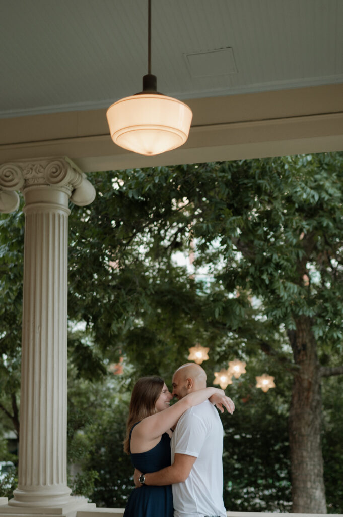 couple embracing at Hotel Ella for engagement photos