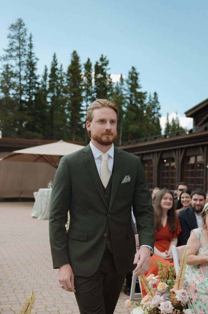 Groom walking down the aisle at TenMile Station