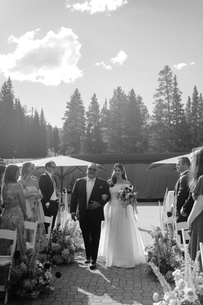 bride and her father walking down the aisle at TenMile Station