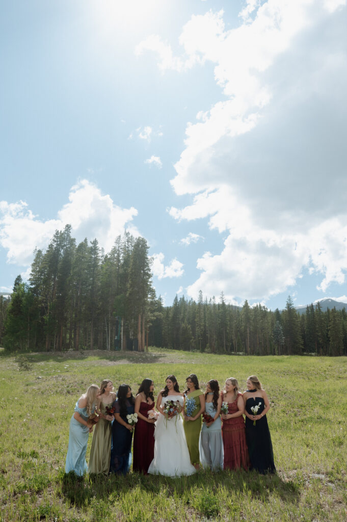 bride and bridesmaids in the mountains in Colorado