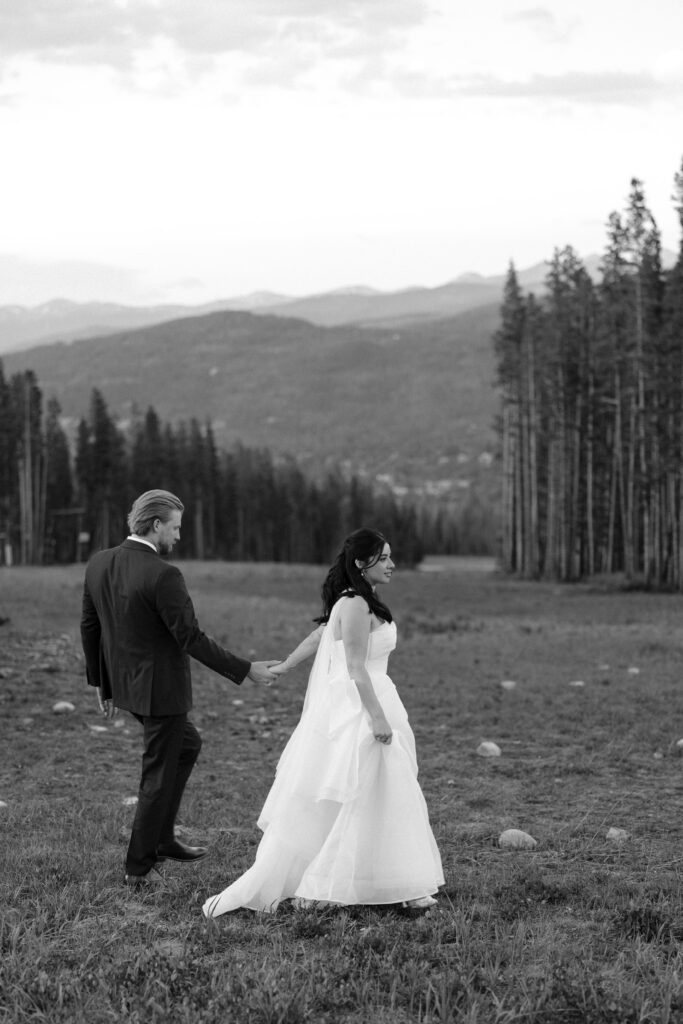 bride and groom walking outside at TenMile station taken by Nicole Endress Photography