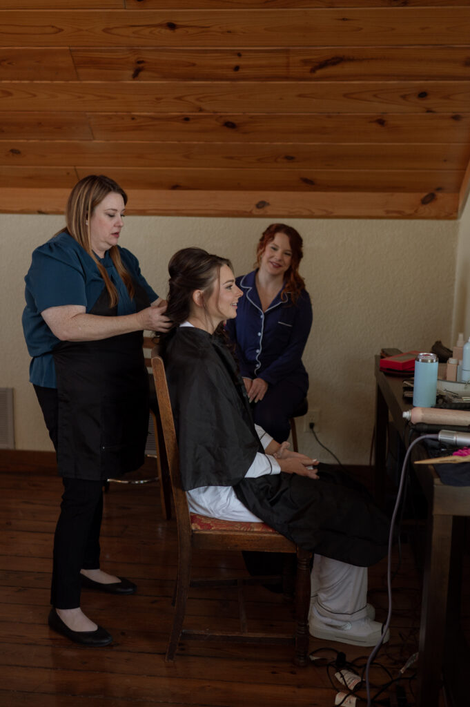 photo of bride getting her hair and makeup done