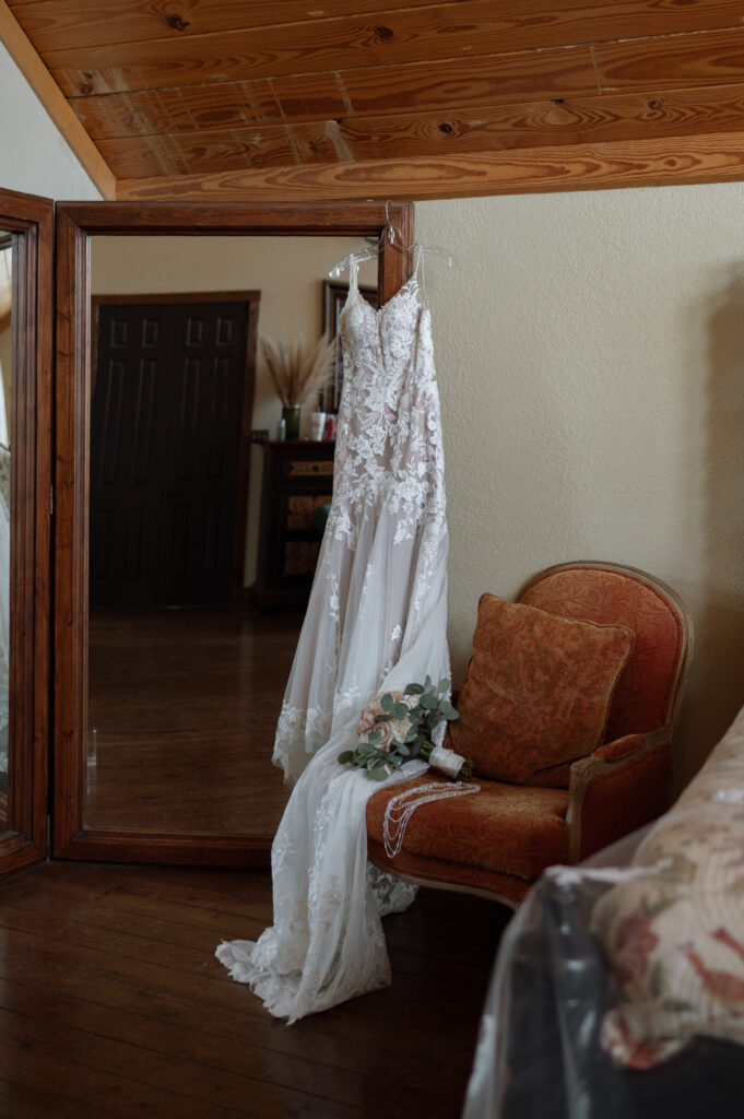 Photo of wedding dress hanging at Avalon Legacy Ranch