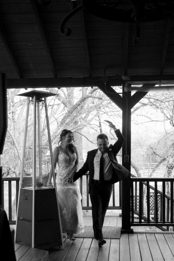 bride and groom entering their reception