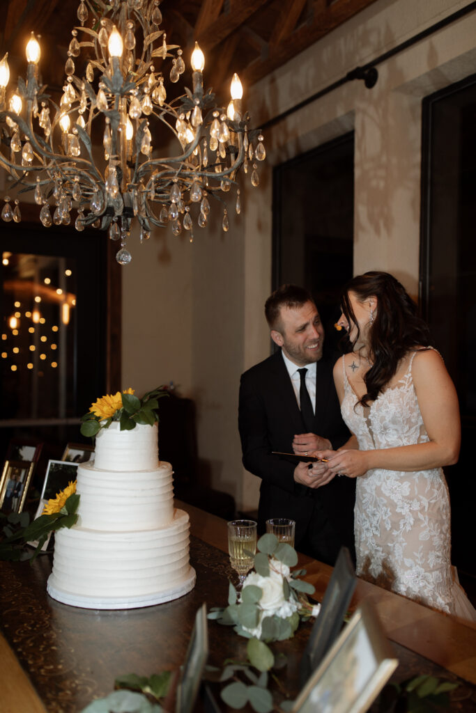 bride and groom cutting cake photo taken by Dallas wedding photographer