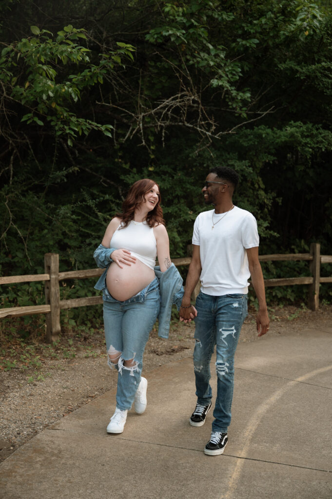 couple walking for maternity photos