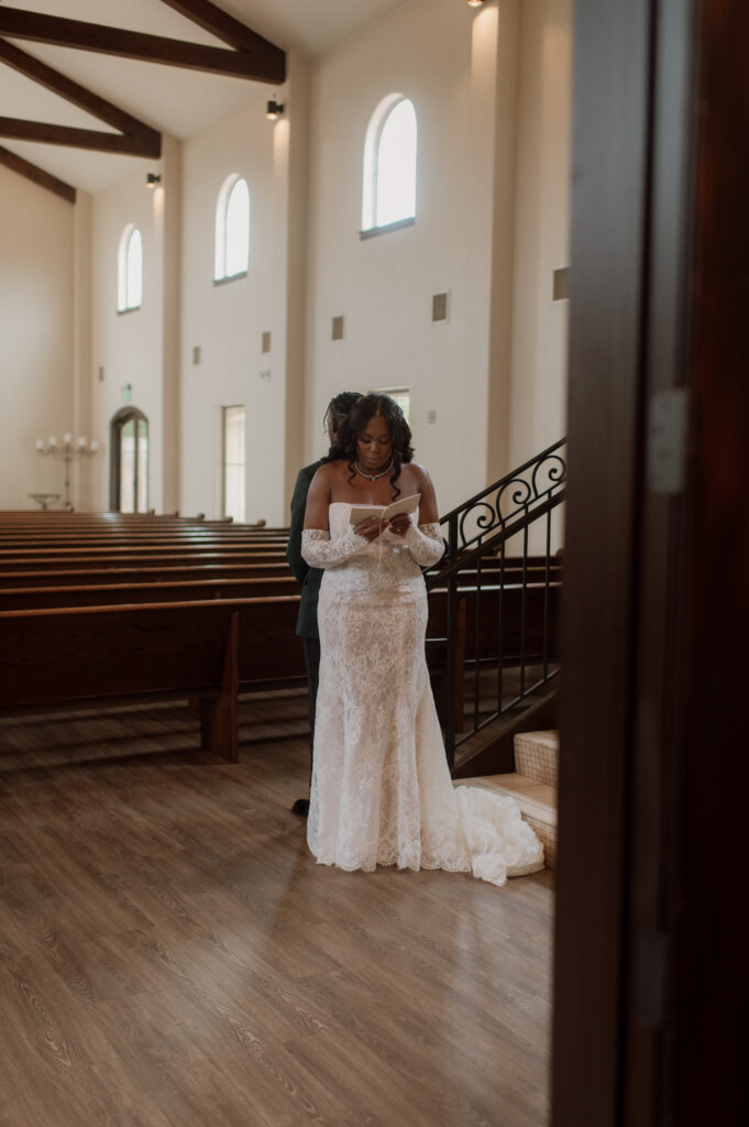 bride and groom first touch and private vows photo at Dallas Wedding Venue