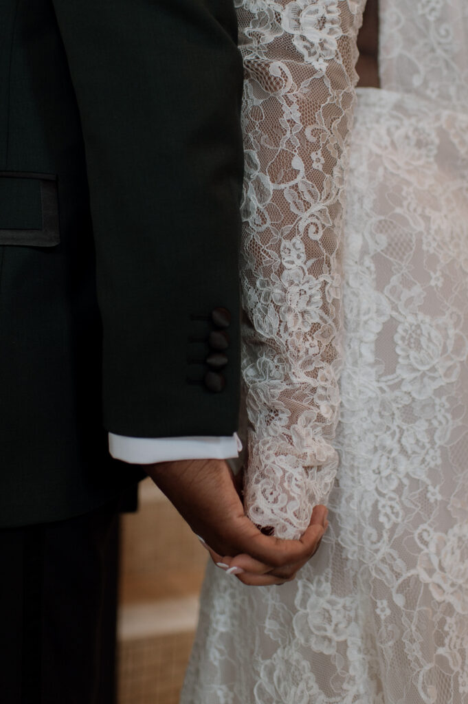 bride and groom holding hands