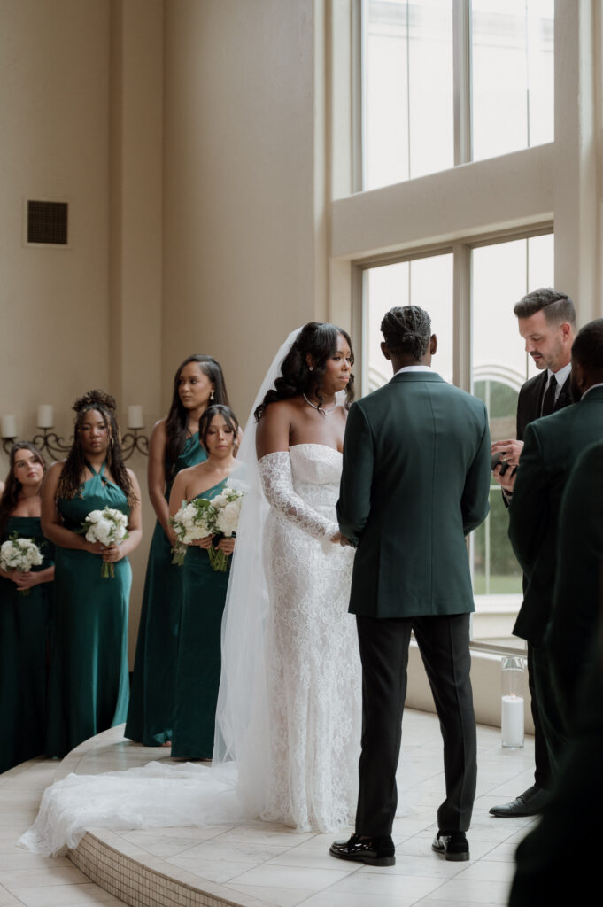 bride and groom exchanging vows during wedding ceremony 