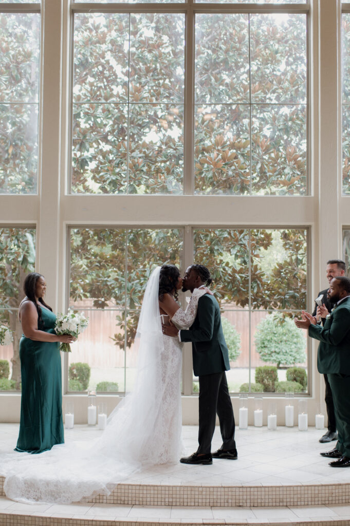 photo of bride and groom first kiss taken by Dallas Wedding Photographer