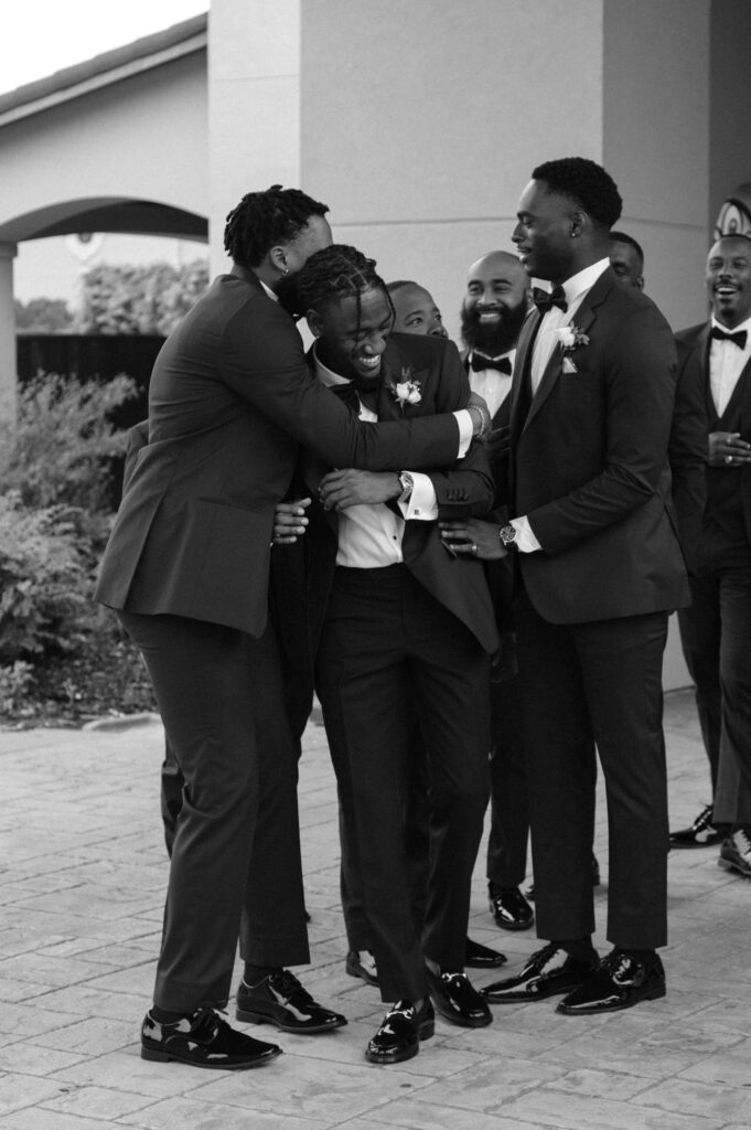 groom and groomsmen having fun together