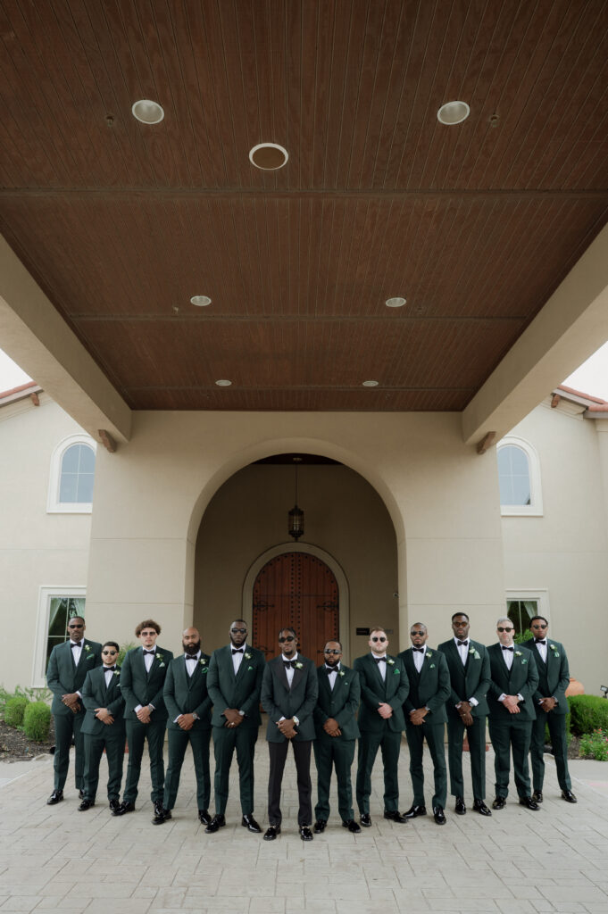 cool photo of groom and groomsmen taken by Dallas Wedding photographer