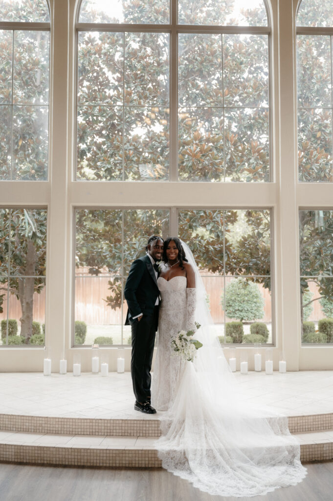 Photo of black bride and groom taken at Chapel at Ana Villa by DFW Wedding Photographer