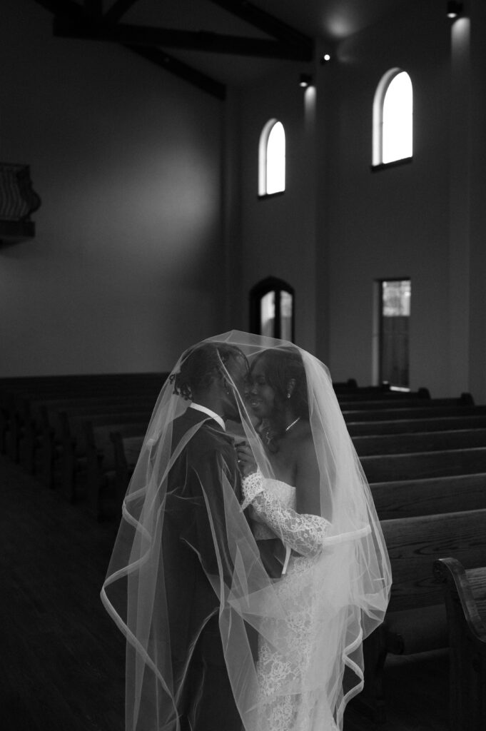 moody black and white wedding chapel photo