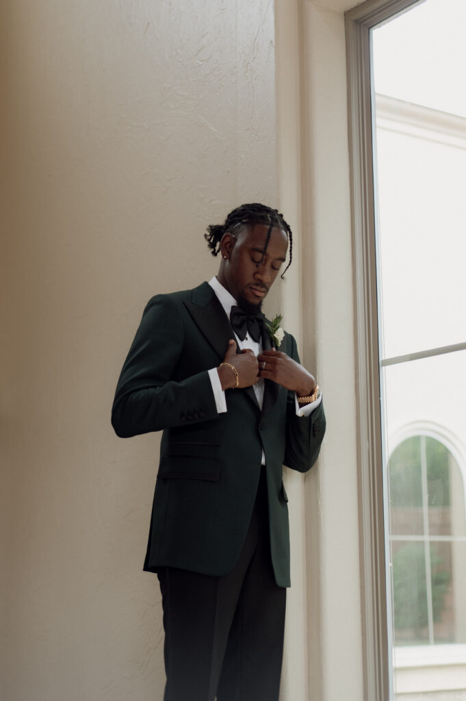 Photo of groom in his custom wedding tuxedo from Sauce Bespoke taken by DFW Wedding Photographer