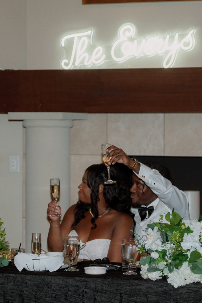 bride and groom with champagne glasses