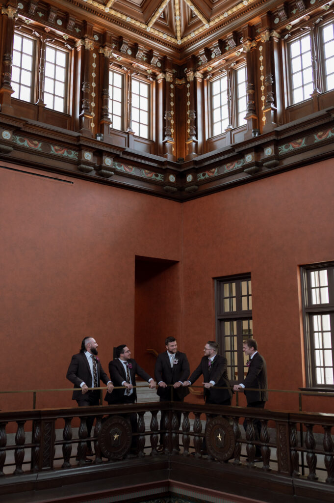 groomsmen photos inside Julia Ideson Building taken by Texas Wedding Photographer