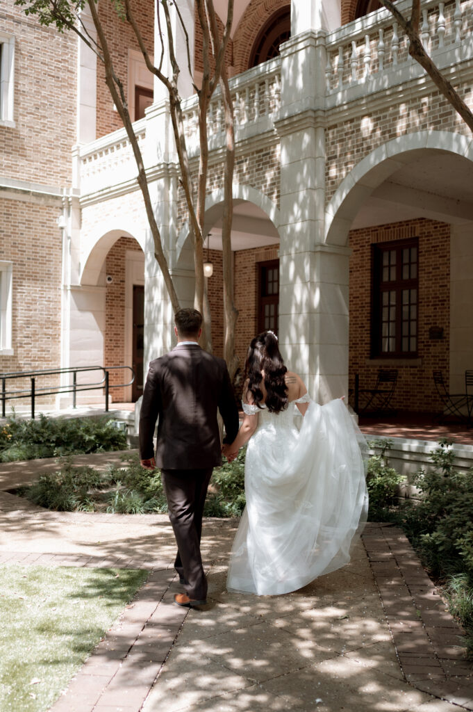 bride and groom walking after first look taken by Texas Wedding Photographer