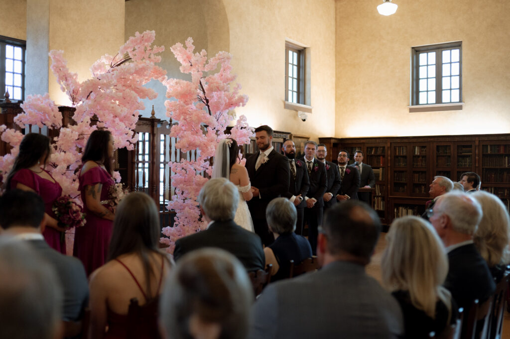 Whimsical storybook wedding ceremony at Julia Ideson Building in Houston, TX