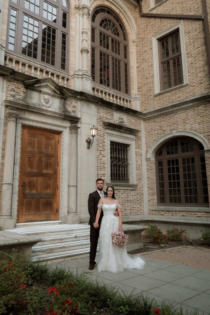 Bride and groom photo outside of Julia Ideson Building in Houston, TX