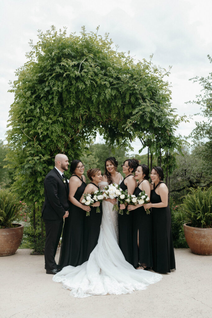 bride and bridesmaids photo taken by Nicole Endress Photography at Fort worth Wedding Venue
