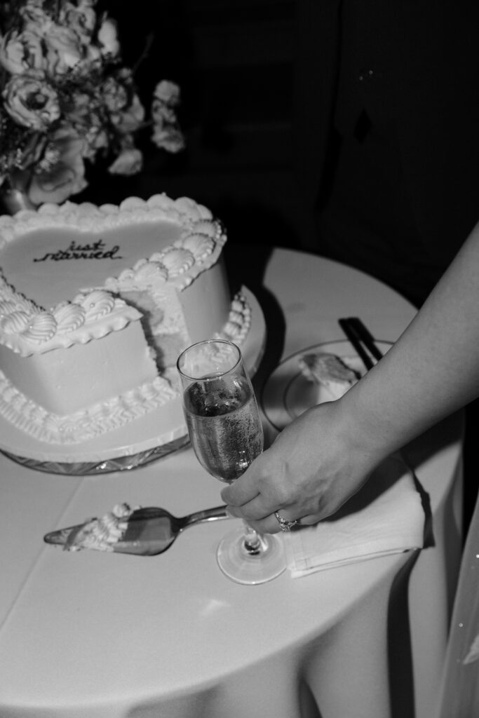 photo of bride reaching for glass of champagne taken at Houston Wedding Venue