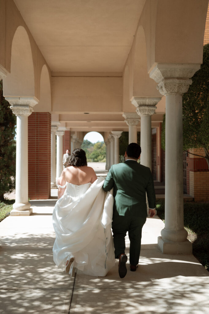 bride and groom walking to the church together