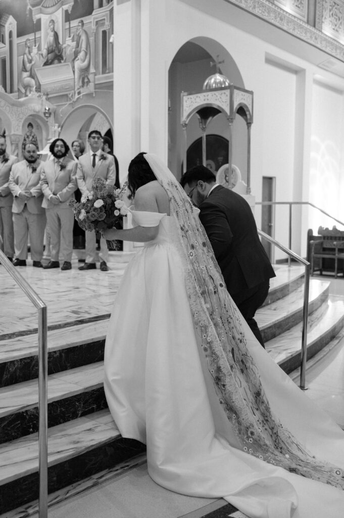 bride and groom walking up the steps at wedding ceremony