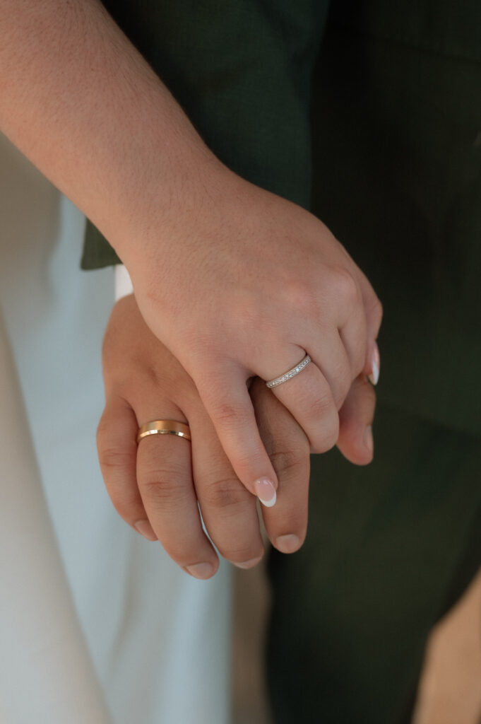 cute hand photo of bride and groom rings